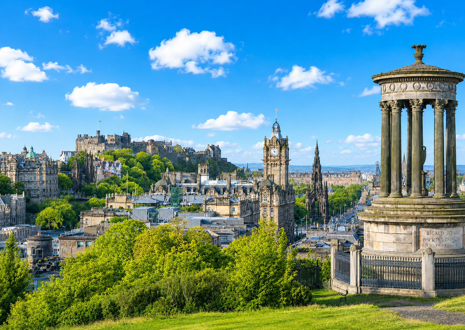 Edinburgh skyline on a clear sunny day with Edinburgh Castle and the Dugald Stewart Monument